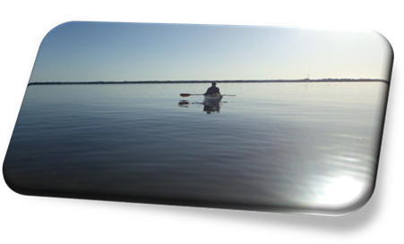 A person in a kayak on the water

Description automatically generated