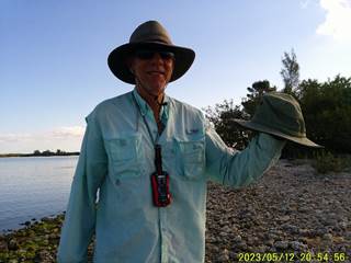 A person wearing a hat and sunglasses

Description automatically generated