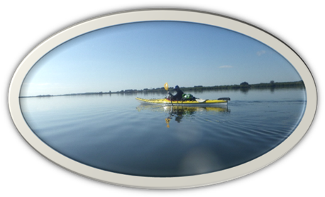 A person in a kayak on the water

Description automatically generated