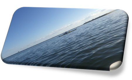 A person in a kayak in the water

Description automatically generated