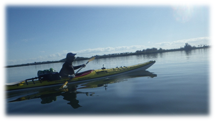 A person in a kayak on the water

Description automatically generated