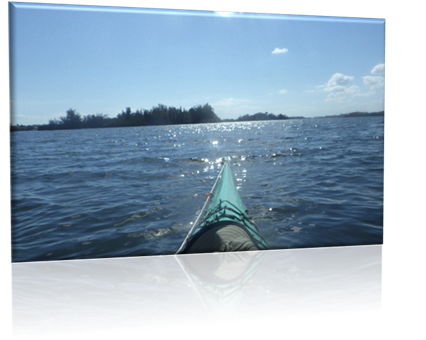 A person's foot in a kayak on the water

Description automatically generated