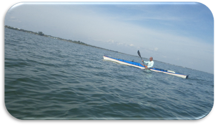 A person in a kayak on the water

Description automatically generated