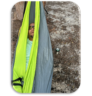 A person lying in a tent

Description automatically generated