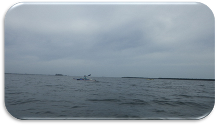 A person in a boat in the water

Description automatically generated