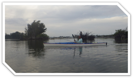 A person in a kayak on a lake

Description automatically generated