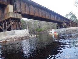 A boat under a bridge

Description automatically generated with low confidence