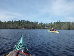 A group of people in kayaks on a lake

Description automatically generated with low confidence
